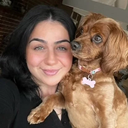 Hub crew member with a cavalier spaniel
